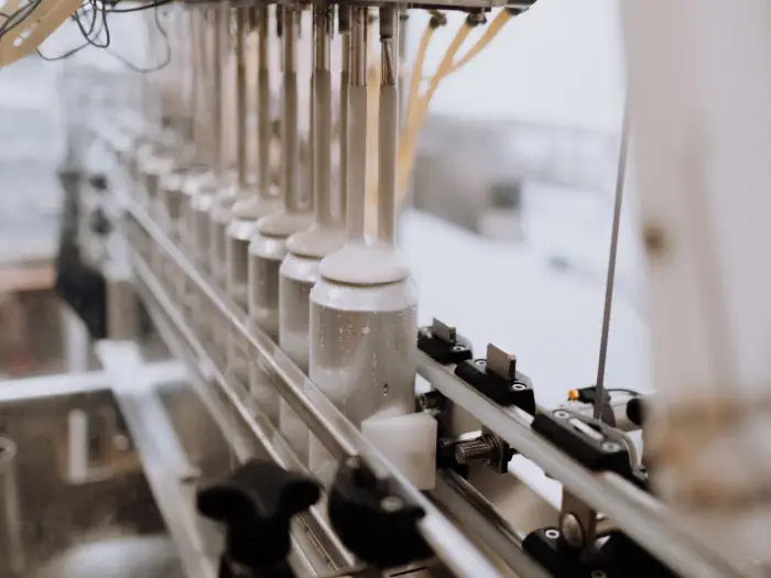 Bottles moving along a filling line in a production facility