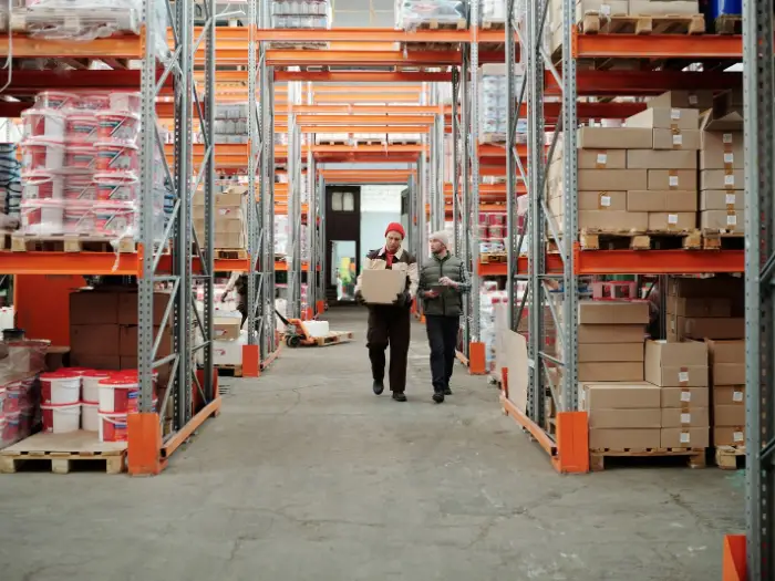 A warehouse aisle stacked with palletised finished goods