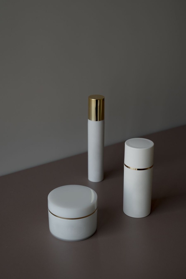 White and gold skincare bottles